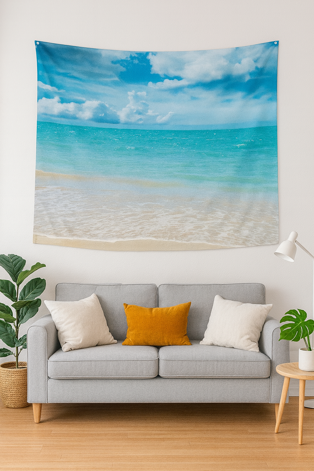 Hawaiian beach tapestry wall hanging with ocean and sky design displayed above modern gray sofa with yellow accent pillow in cozy living room